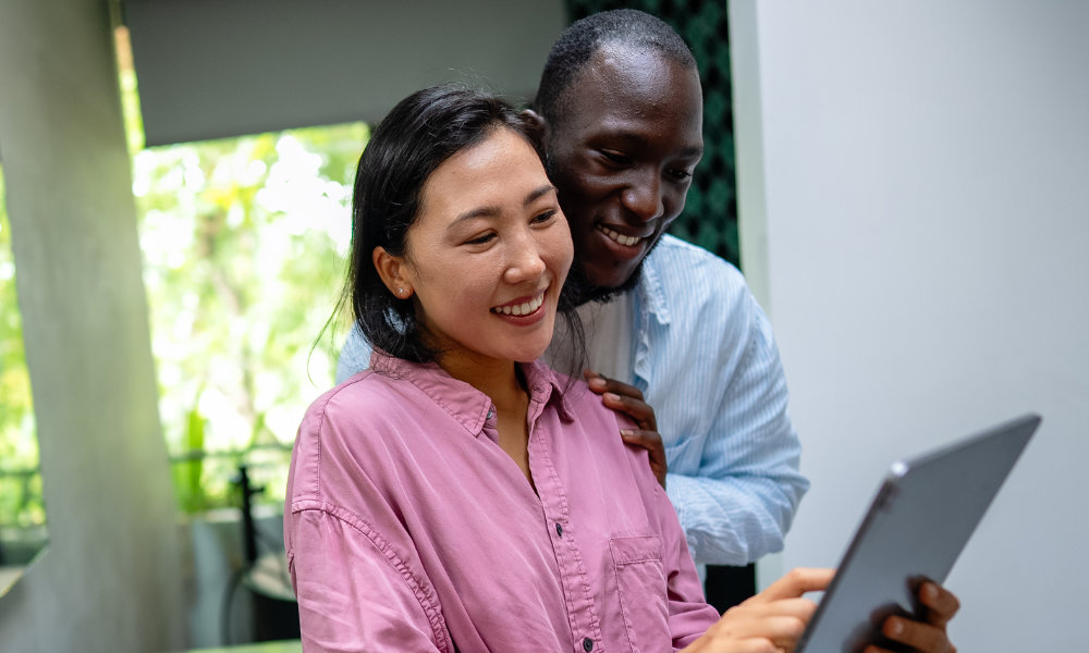 A couple smiles while planning their giving for the future