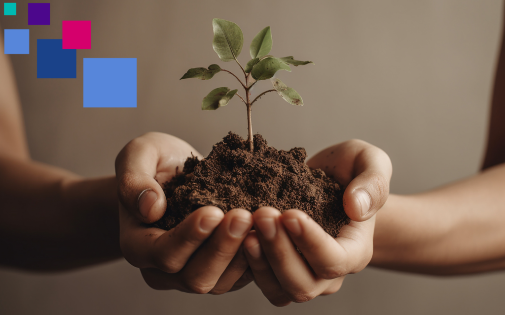 Two hands hold a pile of soil, out of which springs a young tree, like the beginnings of a major gift.